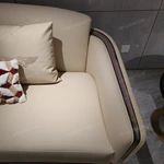Cream Leather Sofa Set with Wave Quilted Craftsmanship, Natural Wood Veneer & Embroidered Wing Logo Accents